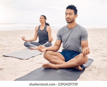 Couple of friends, lotus pose and beach meditation for zen fitness, calm exercise and mindfulness or holistic wellness. Young people in meditation, yoga by sea and ocean or nature for mental health - Powered by Shutterstock
