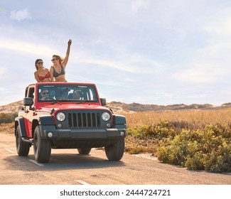 Couple With Friends On Vacation Driving Car On Road Trip Adventure To Beach With Women Standing - Powered by Shutterstock