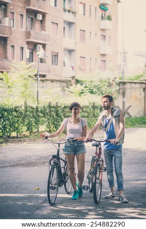 Similar – Happy young people walking along road in summer day