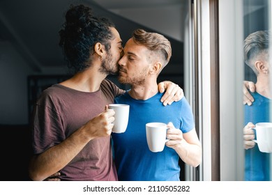 Couple of gay men drinking coffee at home, morning ritual of same sex lovers, gay pride and marriage lifestyle