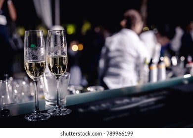 Couple Glasses Of Champagne Leaving On The Bar In The Party