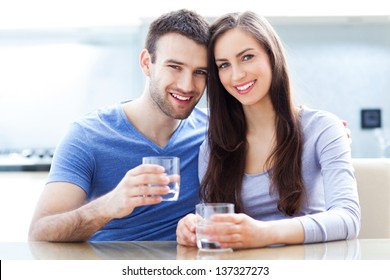 Couple with glasses of water - Powered by Shutterstock