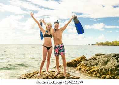 Couple Is Going To Swim And Snorkle On Hawaii Beach