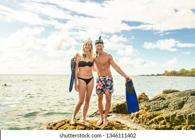 Couple Is Going To Swim And Snorkle On Hawaii Beach