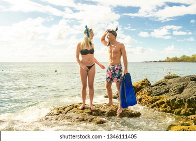 Couple Is Going To Swim And Snorkle On Hawaii Beach