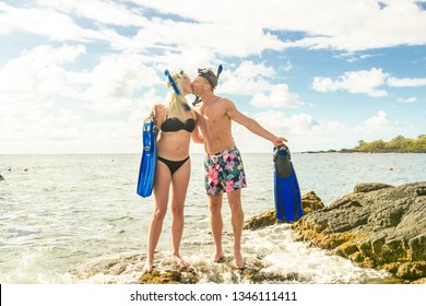 Couple Is Going To Swim And Snorkle On Hawaii Beach