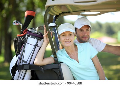 Couple In Golf Cart