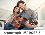 Couple, guitar and music in apartment for love, bonding and romantic gesture in relationship in bedroom. Man, musician and woman in house for playing instrument, singing and relax together with smile