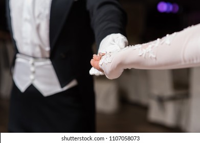 Couple Hands Dancing Waltz At Ball