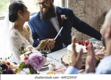 Couple Hands Holding Wedding Cake Knife