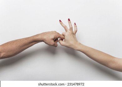 Couple hands making sex gesture