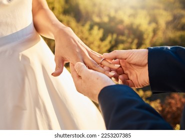 Couple hands, wedding ring and love ceremony outdoor with jewelry and save the date announcement. Engagement, together and marriage of people in nature at commitment and engagement event with faith - Powered by Shutterstock