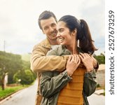 Couple, happy and outdoor for hug with love, protection and security or care in marriage. Man, portrait or woman on estate with safety, romance or commitment in relationship with travel for honeymoon