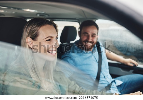 Couple, happy and road trip car travel of people
with a smile using motor transportation. Happiness, love and relax
traveling drive experience of a girlfriend and boyfriend together
ready for holiday