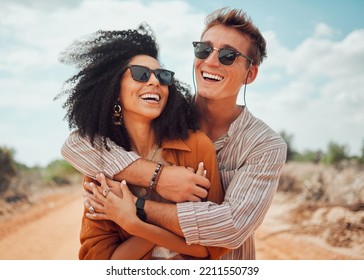 Couple, happy and smile hug in nature on a travel, adventure and road trip outdoor. Happiness of traveling girlfriend and boyfriend together in the summer sun with quality holiday time in the dessert - Powered by Shutterstock