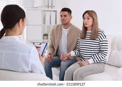 Couple Having Appointment With STD Specialist In Clinic