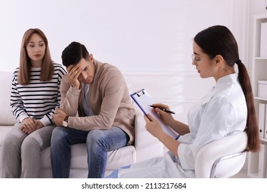 Couple Having Appointment With STD Specialist In Clinic