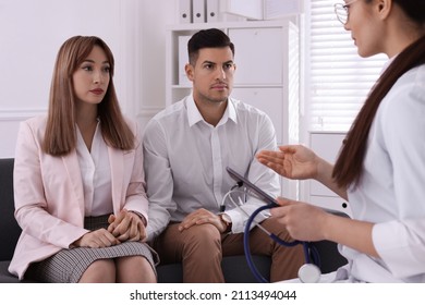 Couple Having Appointment With STD Specialist In Clinic