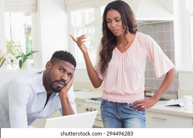 Couple having an argument at home in the kitchen