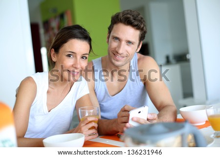 Couple having breakfast at home