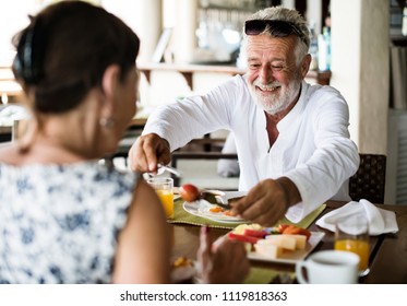 Couple Having Breakfast At A Hotel