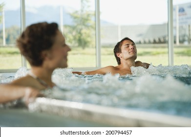 Couple having bubble bath in hotel