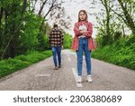 Couple is having difficulties in their relationship. Man is leaving his woman after argue. Conceptual image.