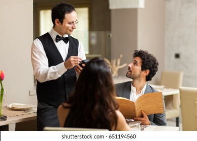 Couple Having Dinner In A Luxury Restaurant