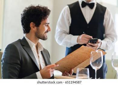 Couple Having Dinner In A Luxury Restaurant