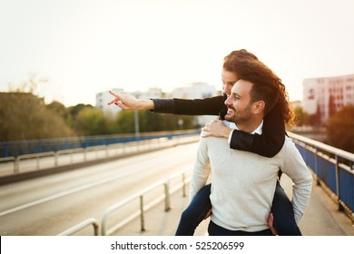 Couple Having Fun Outdoors And Exploring City