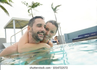 Couple having fun at the swimming-pool - Powered by Shutterstock