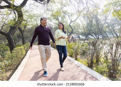 Couple having fun while admiring view at park - Powered by Shutterstock