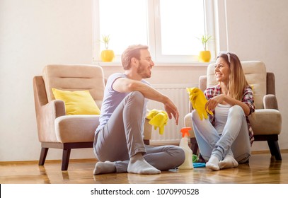 Couple Having Fun While Doing Spring Cleaning Together