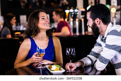 Couple having a glass of wine in a bar