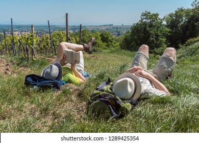 Couple Having Hiking Break In Vineyards In Germany Near France Border