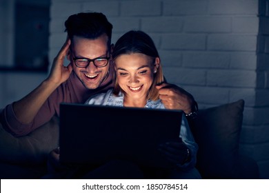 Couple having movie night at home