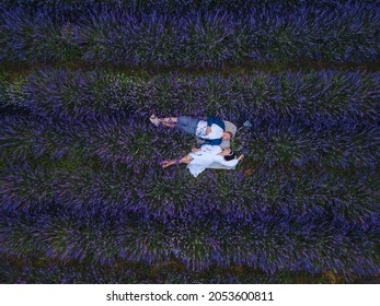 Couple Having Romantic Date Picnic At Lavender Field Overhead Top View