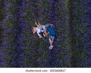 Couple Having Romantic Date Picnic At Lavender Field Overhead Top View