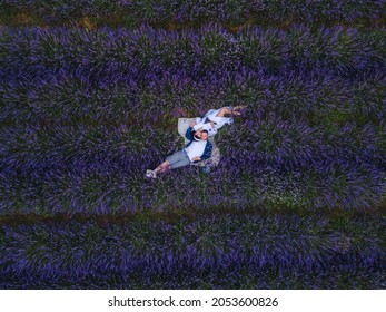 Couple Having Romantic Date Picnic At Lavender Field Overhead Top View