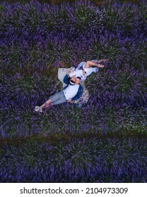 Couple Having Romantic Date Picnic At Lavender Field Overhead Top View