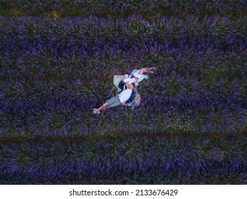 Couple Having Romantic Date Picnic At Lavender Field Overhead Top View