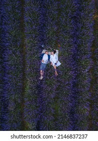 Couple Having Romantic Date Picnic At Lavender Field Overhead Top View