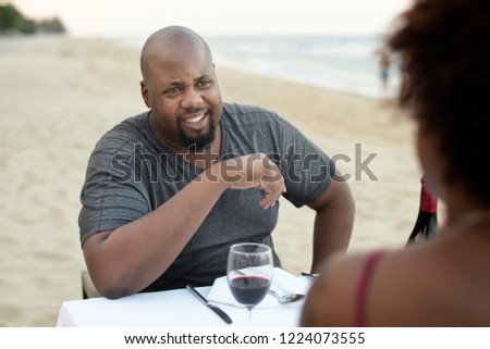 Couple having a romantic dinner at the beach