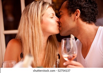 A Couple Having A Romatic Meal In An Outdoor Restaurant