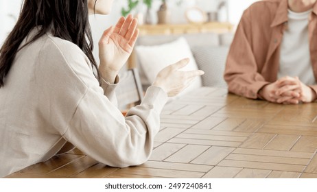 Couple having a serious conversation in the living room - Powered by Shutterstock