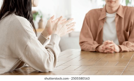 Couple having a serious conversation in the living room - Powered by Shutterstock