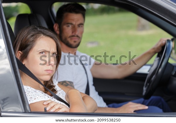 couple having a serious\
talk in a car