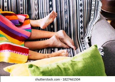 Couple Having Sex Activity Concept With Nude Feet And Coloured Cover On The Sofa At Home - People Lover And Sexual Active Lifestyle - Home Real Life For Unrecognizable Man And Woman In Relationship