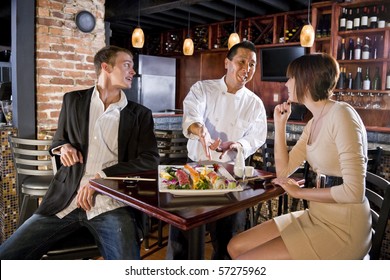 Couple having sushi in Japanese restaurant talking with chef - Powered by Shutterstock