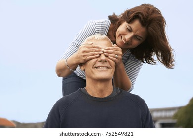 Couple, Her Hands Over His Eyes